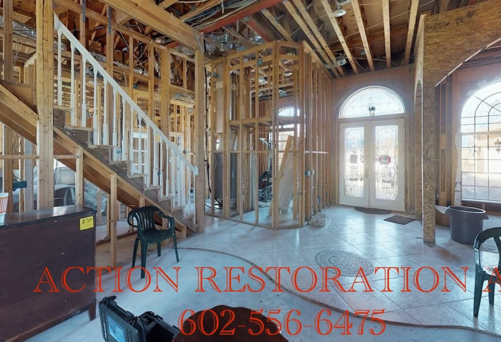 Interior of a house under construction with exposed wooden framing and stairs.